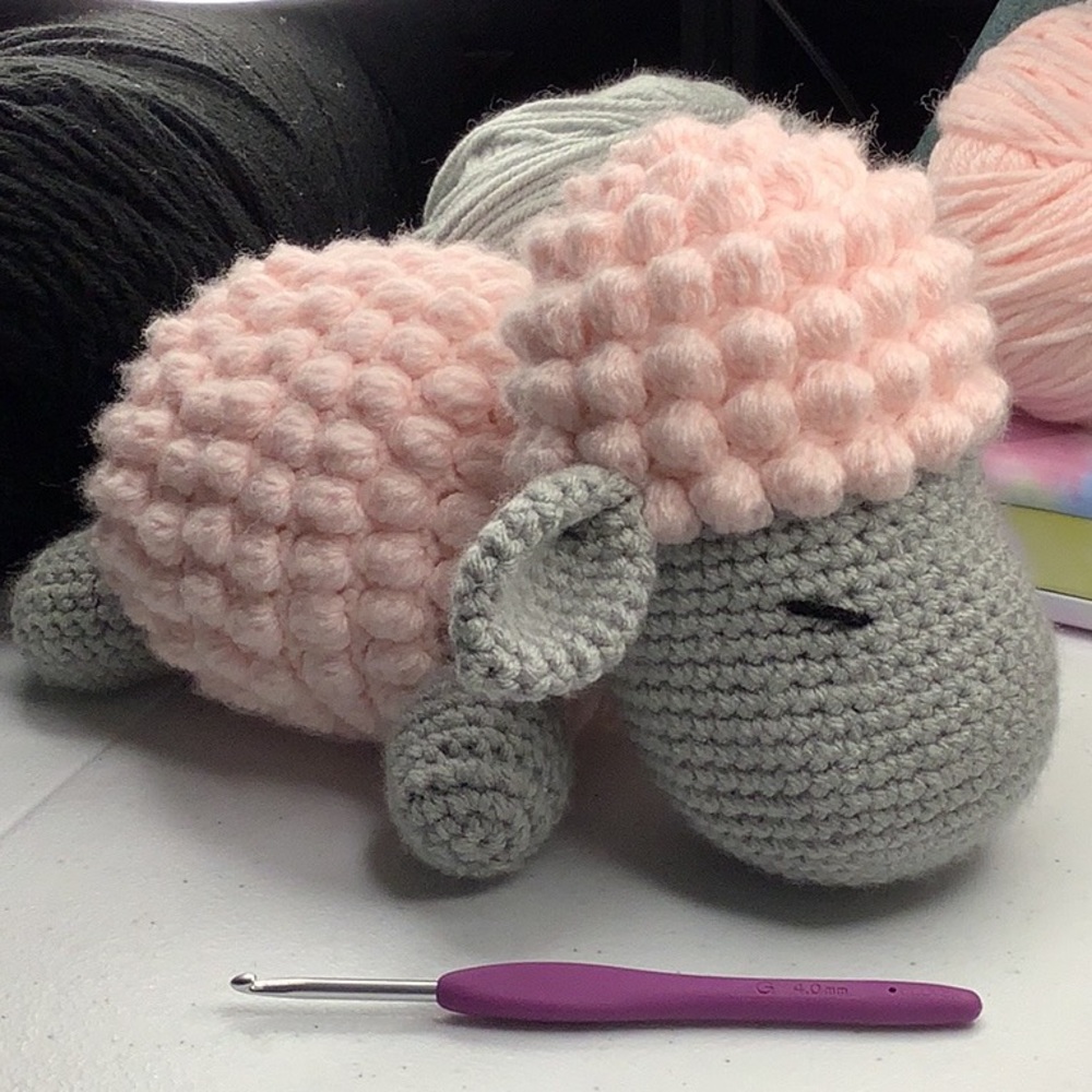 Handmade sleeping sheep Amigurumi in pink and gray crochet bobble stitch sheep